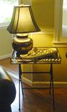 MANY METAL AND GLASS DECORATIVE SIDE TABLES AND GORGEOUS BRASS LAMPS