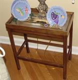 ANTIQUE BRASS FITTED SIDE TABLE WITH HANDPAINTED AND SIGNED SAUCERS