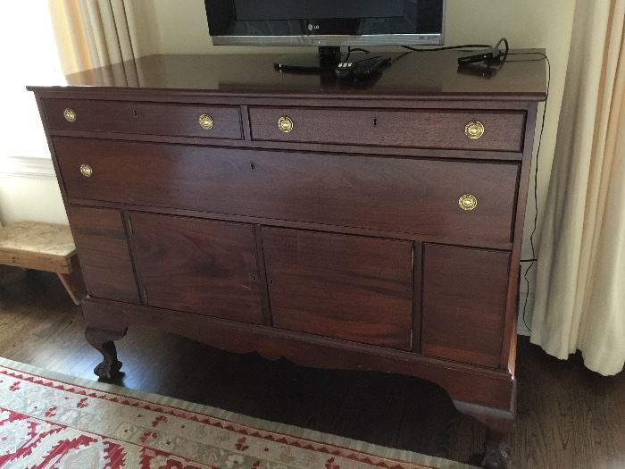 Mahogany 3 Drawer Over 2 Door Tall Sideboard with Claw and Ball Feet, c. 1870 (57" x 24" x 41")  
Pale Green and Red Oriental Rug (12' x  9') 
 