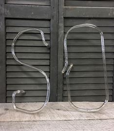 Lot of two old neon signage letters spelling the word SO. Did you know that neon signs are becoming extinct to their predecessors LED lighting? Fun steam punk looking letters. Would look great mount to just weathered wood or something really fun!