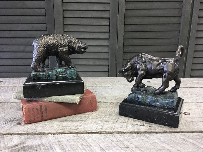 The Bull and Bear of Wall Street bookends by Design Toscano. Quality foundry cast iron collectible crafted using age old techniques Each piece is individually hand-finished in antique bronze mounted on a Marble base. The bull has a minor imperfection on his horn. Books not included. Est retail value is $130.00. I already deducted for the bulls small imperfection. Overall: 8.5'' H x 6.5'' W x 5.5'' D. Overall Product Weight: 10lb.