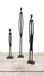 Lot of three Pottery Barn very heavy modern decorative iron sculptures measures approximately 24 inches tall, 19 inches tall, 14 inches tall. Original price tags total hundred dollars are all three.
