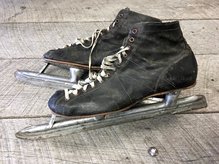 1930s Olympic style speed skates. The blades are engraved with Invictus on them. All leather with the bottom of the leather sole embossed size 10. In very industrial vintage condition just the way we Minnesotans like our skates, specially the ones we want to display. Who knows perhaps these were warn by some great Olympian!!
