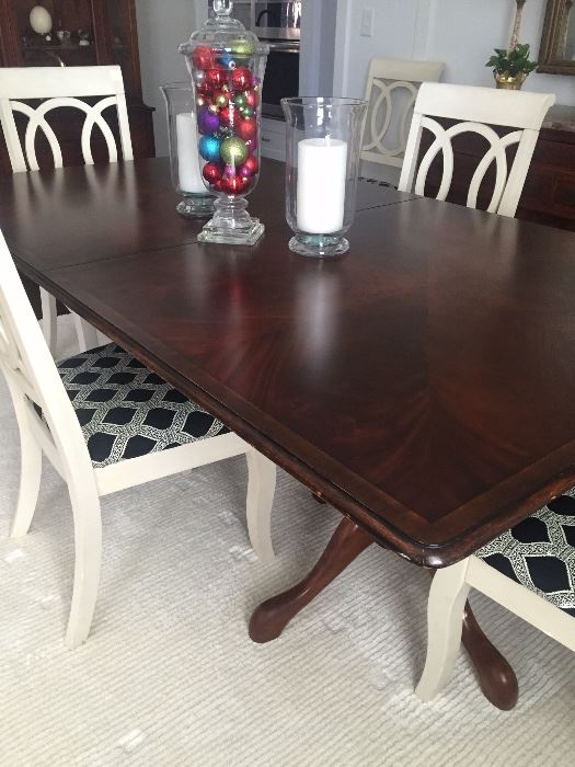 Double pedestal table with 6 white chairs (priced separately)