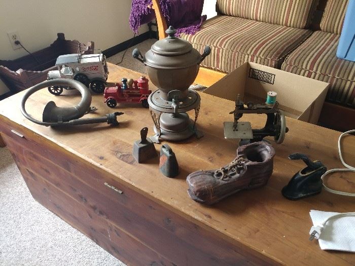 Selection of antiques, cast iron toys, instruments