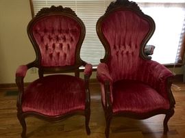 Antique his and hers parlor chairs.