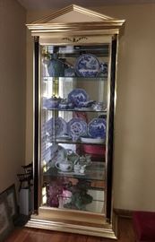 Unique lighted curio cabinet with side doors--metallic gold-tone.