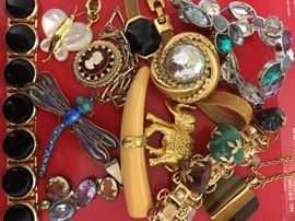 Packed table full of costume jewelry.