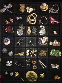 Packed table full of costume jewelry.