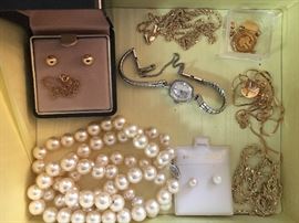 Some gold and sterling silver jewelry.