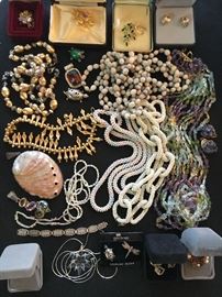 Packed table full of costume jewelry.
