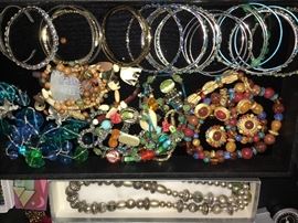 Packed table full of costume jewelry.