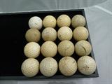 Group of 16 vintage golf balls.