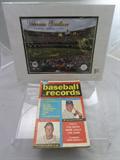 The First Complete Book of Baseball Records No. 1, 1957 together with photo of Veteran's Stadium final game September 28, 2003.