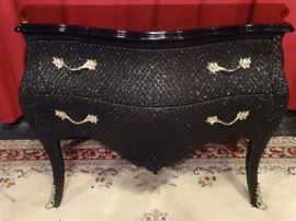 LARGE BLACK BOMBE CHEST WRAPPED IN FABRIC