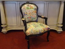 LOUIS XV STYLE ARMCHAIR WITH CARTOON PRINT ON LEATHER UPHOLSTERY, TOM AND JERRY IN FRENCH, ENGLISH, AND GERMAN, BLACK FINISH