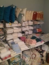 Lots of pillows, sheets, blankets, etc