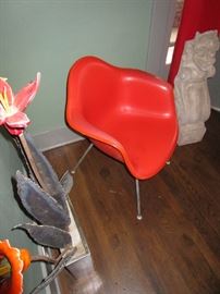 Vintage Eames shell chair, orange vinyl upholstered