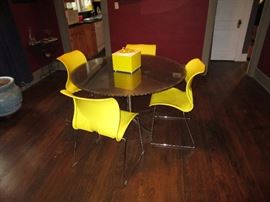 4' diameter table made from a masonry blade, glass top, stainless steel base (blade was used to cut windows in a 2' thick brick wall in a renovation of a South Main warehouse)