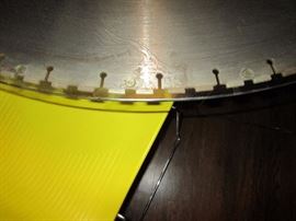 4' diameter table made from a masonry blade, glass top, stainless steel base (blade was used to cut windows in a 2' thick brick wall in a renovation of a South Main warehouse)