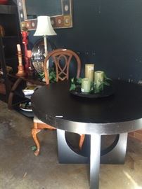 Black round table with unique base