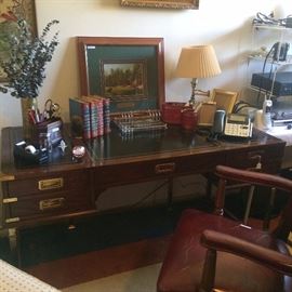 Good-looking wood and brass leather-top desk