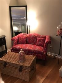 Susan Sargent upholstered loveseat, tall mirror, wicker hamper