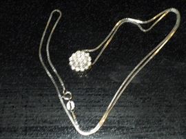 14kt White gold diamond Cluster Pendent. 19 round diamonds on a box chain. Appraisal available from June 2006.