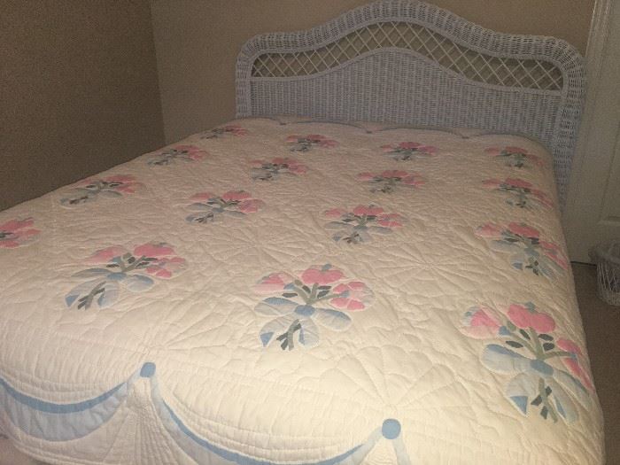 Queen size wicker bed  with two matching bed side tables . * vintage quilt
