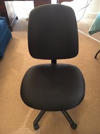 Black rollable desk chair (just purchased). Quilt 100% polyester