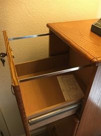 Solid oak 4-drawer file cabinet w/brass fixtures & key