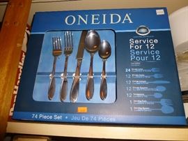 New in box Oneida flatware service for 12