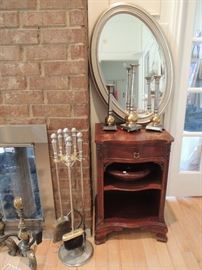 oval mirror, fireplace tools, vintage table