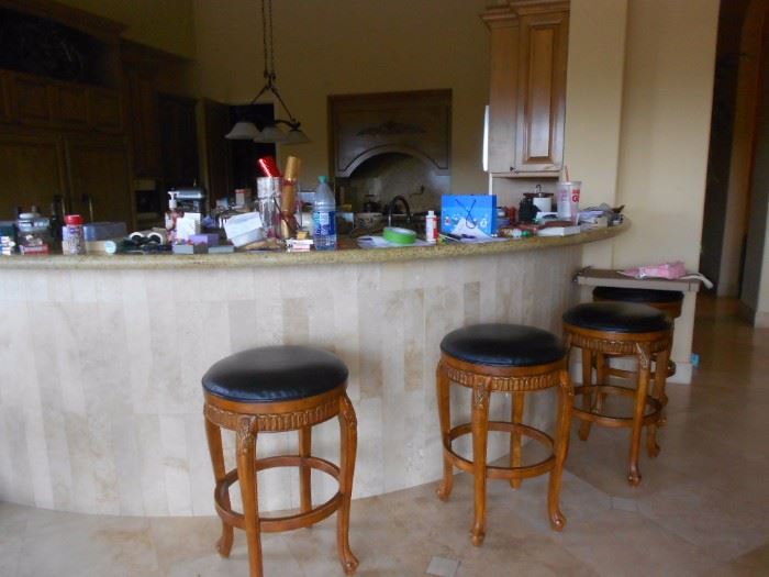 Four bar stools. Should fit island height also.