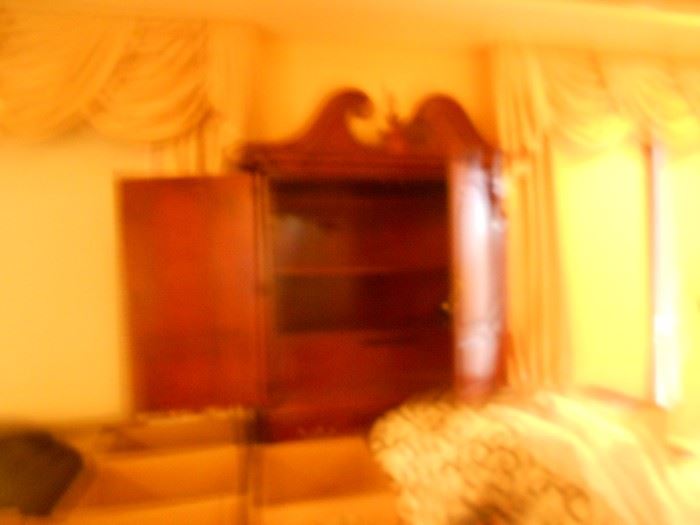 I am an EXPERT photographer!  I will retake this photo later when I am in the house working.  But as you can see, it is an amazing armoire that matches the Thomasville bedroom set with poster bed.