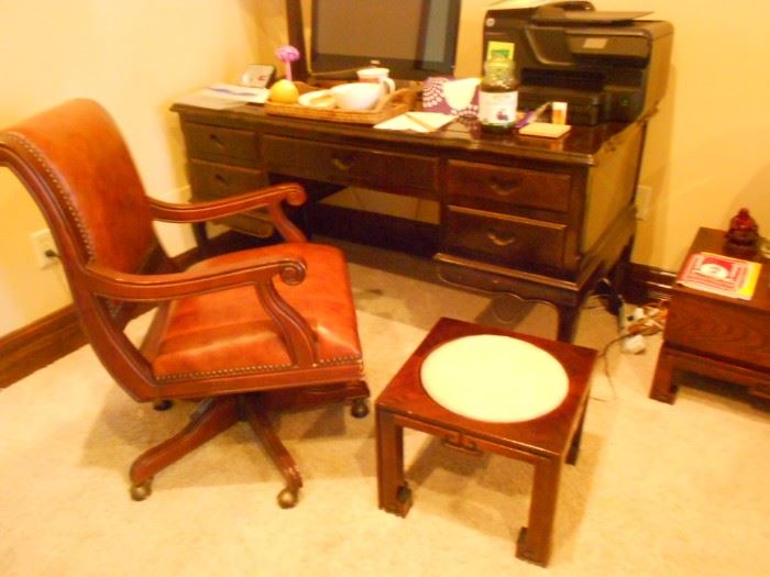 Beautiful classic leather chair, and wood desk.