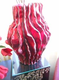 Unique vase.  Is it a melting candle?  Is it coral?  Beautiful accessory that compliments the red lacquer pieces.
