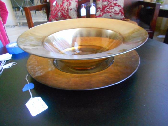 Clear glass plate and bowl with polished gold trim.