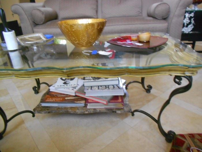 Coffee table with marble shelf, yellow wood interior trim, bronze metal legs and scalloped glass. Very unique!