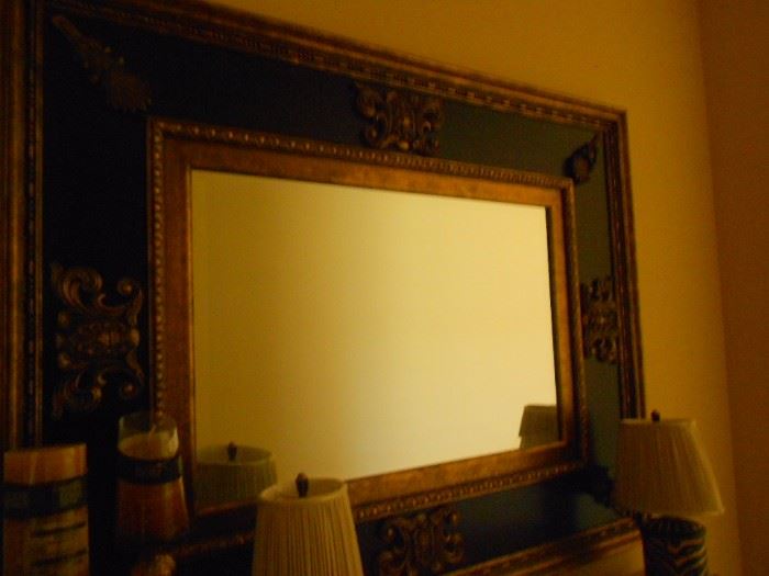 One of a pair of mirrors over a pair of tables in the upstairs hall.