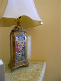 Lamp, mirror with gold trim.