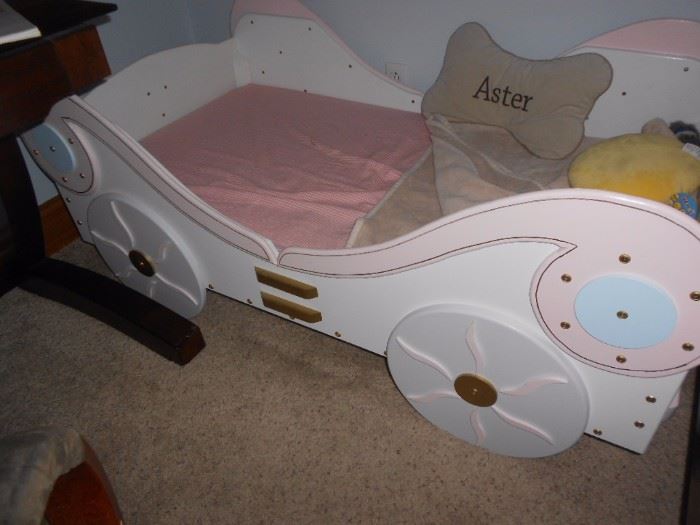 Toddler bed.  Used as doggie bed.  Either way, very cute!