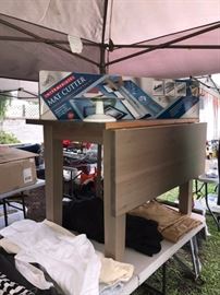 SMALL WOOD TABLE, MAT CUTTER, CLOTHES, SWIRLING CAKE DECORATOR STAND