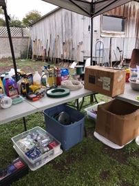 CHEMICALS, GARAGE ITEMS, LOTS OF YARD TOOLS IN BACKGROUND