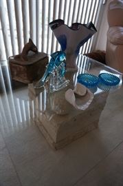 Glass coffee table with tessellated stone base