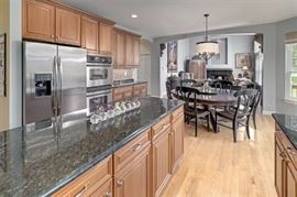 Round Pine Kitchen Table, w / 8 black chairs 