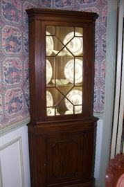 Beautiful mahogany lighted corner cupboard by Henkel Harris.  Very nice smaller size.