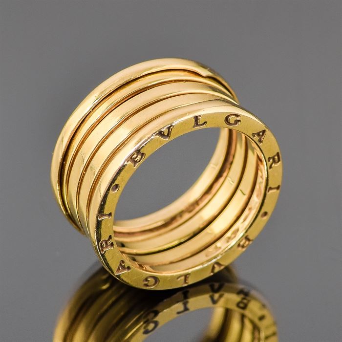 Bvlgari B.Zero1 18K Yellow Gold Ring: A Bvlgari 18K yellow gold ring. This ring is a size 8.75 and features three spiraled 18K yellow gold bands to the center. The rim is marked Bvlgari and the interior is marked Made in Italy 750 Bvlgari. It has an approximate total weight of 8.1 dwt.