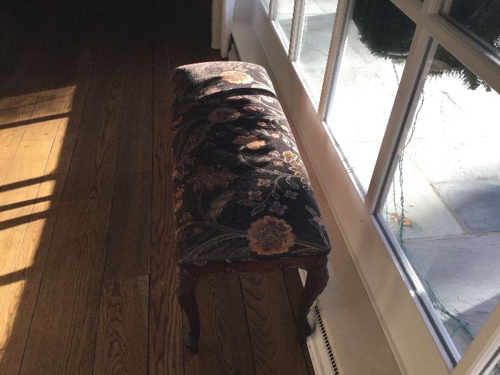 Wood bench with floral upholstery 