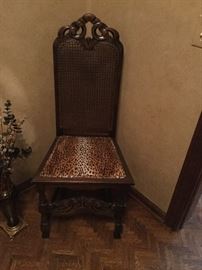 Cane backed chair with leopard seat